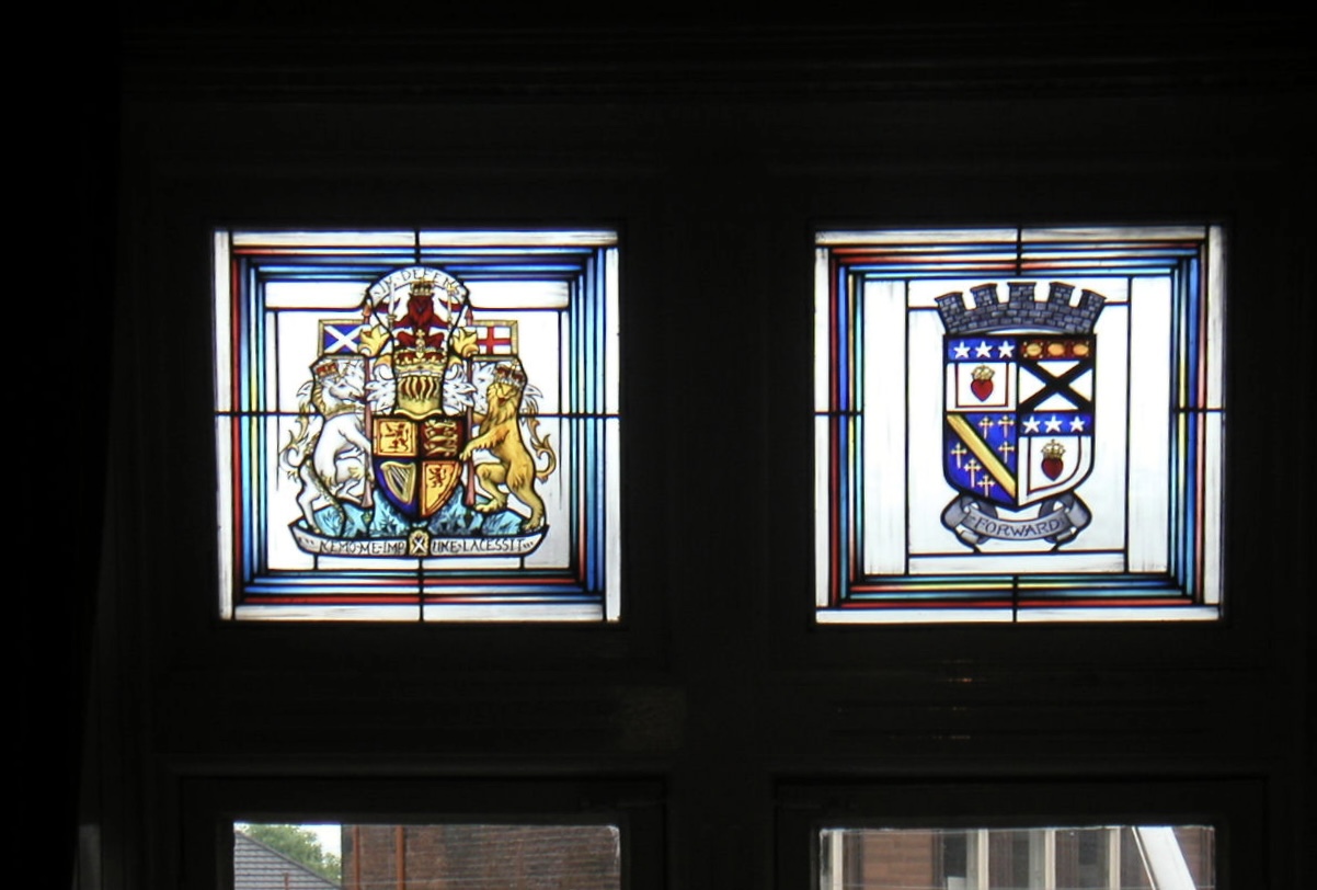 The Royal Coat of Arms of Scotland and a civic coat of arms, Lesser Town Hall, Lockerbie