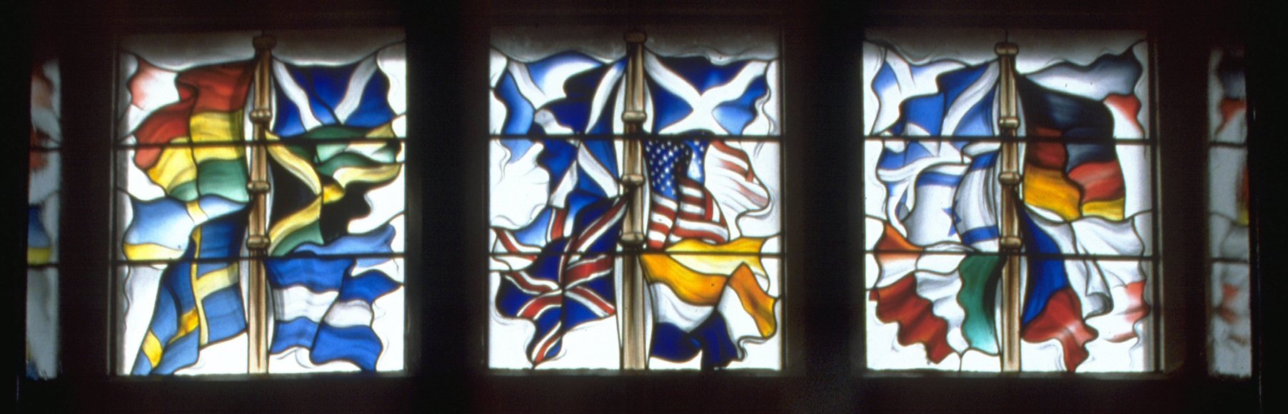 Lockerbie Memorial Window — the flags of the nations of the victims of Pan Am Flight 103, Lesser Town Hall